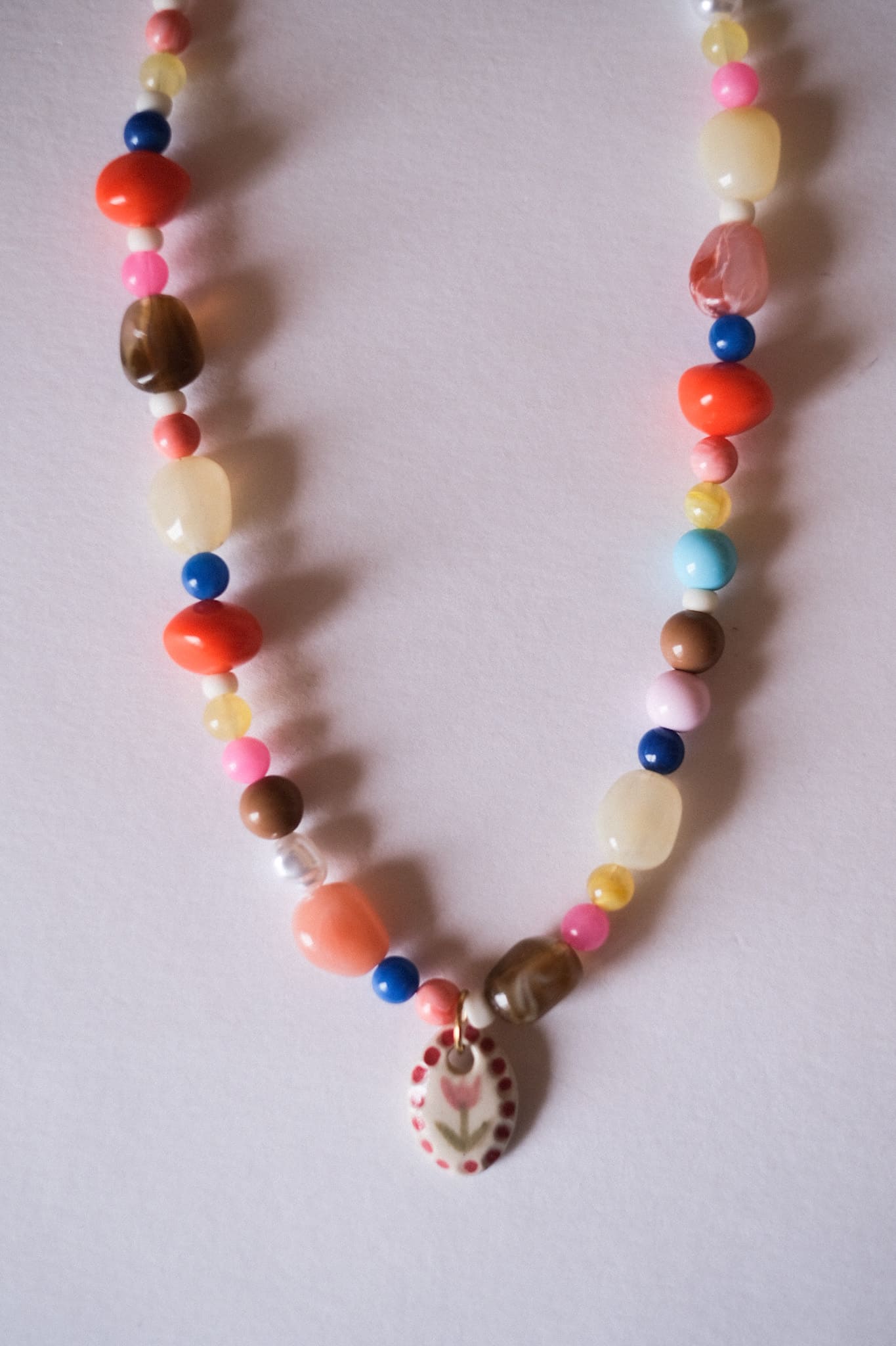 Collier unique en acier inoxydable, médaille céramique
