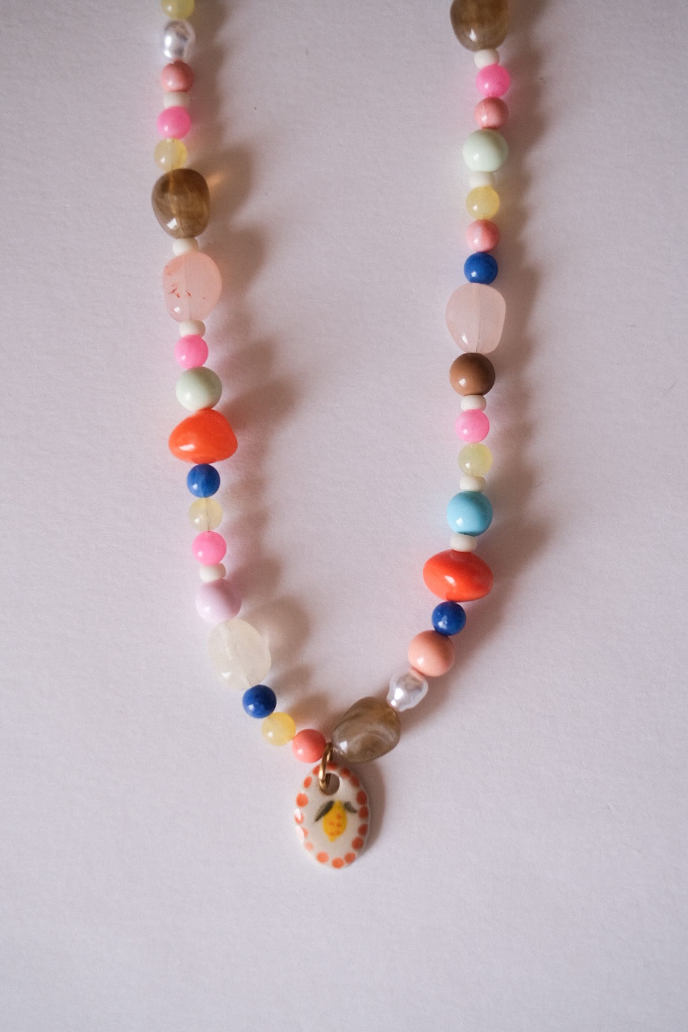 Collier unique en acier inoxydable, médaille céramique