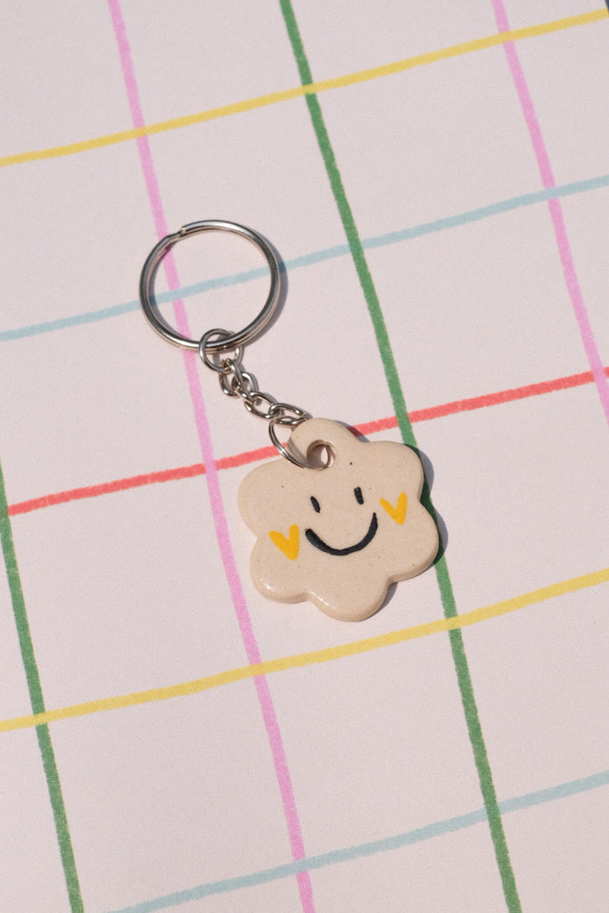 Porte clés gri-gri fleur – sourire et joues en cœur